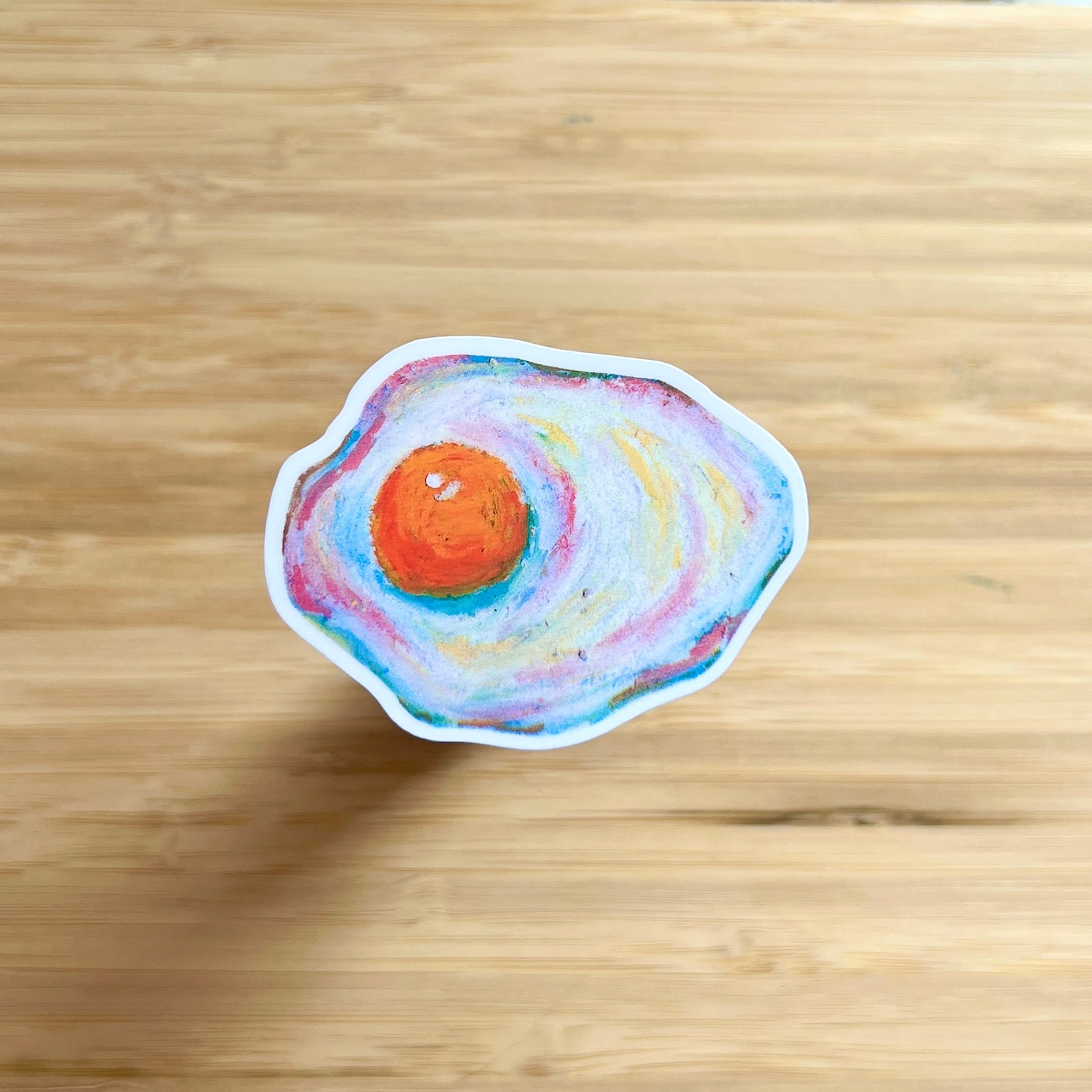 egg sticker on wooden surface