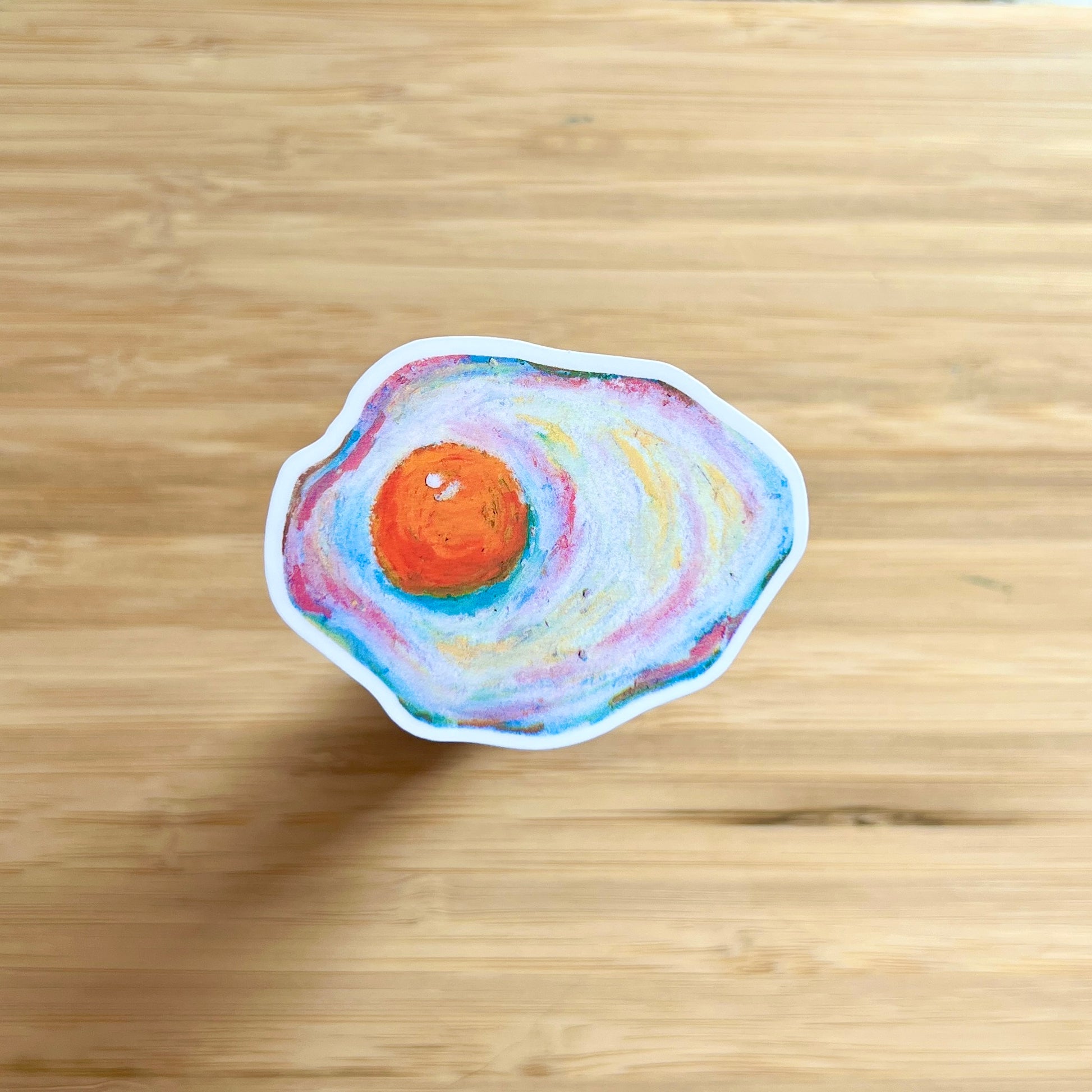 egg sticker on wooden surface