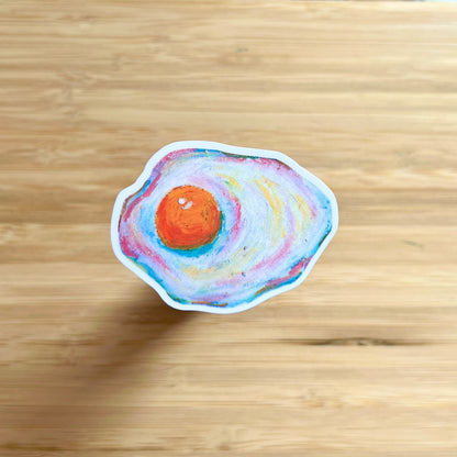 egg sticker on wooden surface