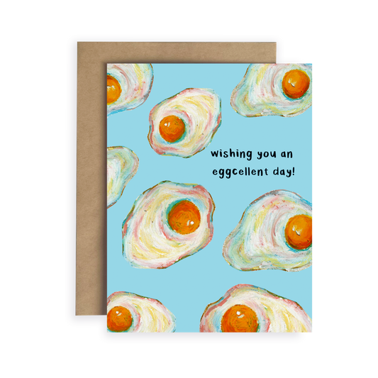 Greeting card with watercolor eggs and text 'Wishing you an eggcellent day!' on a blue background.