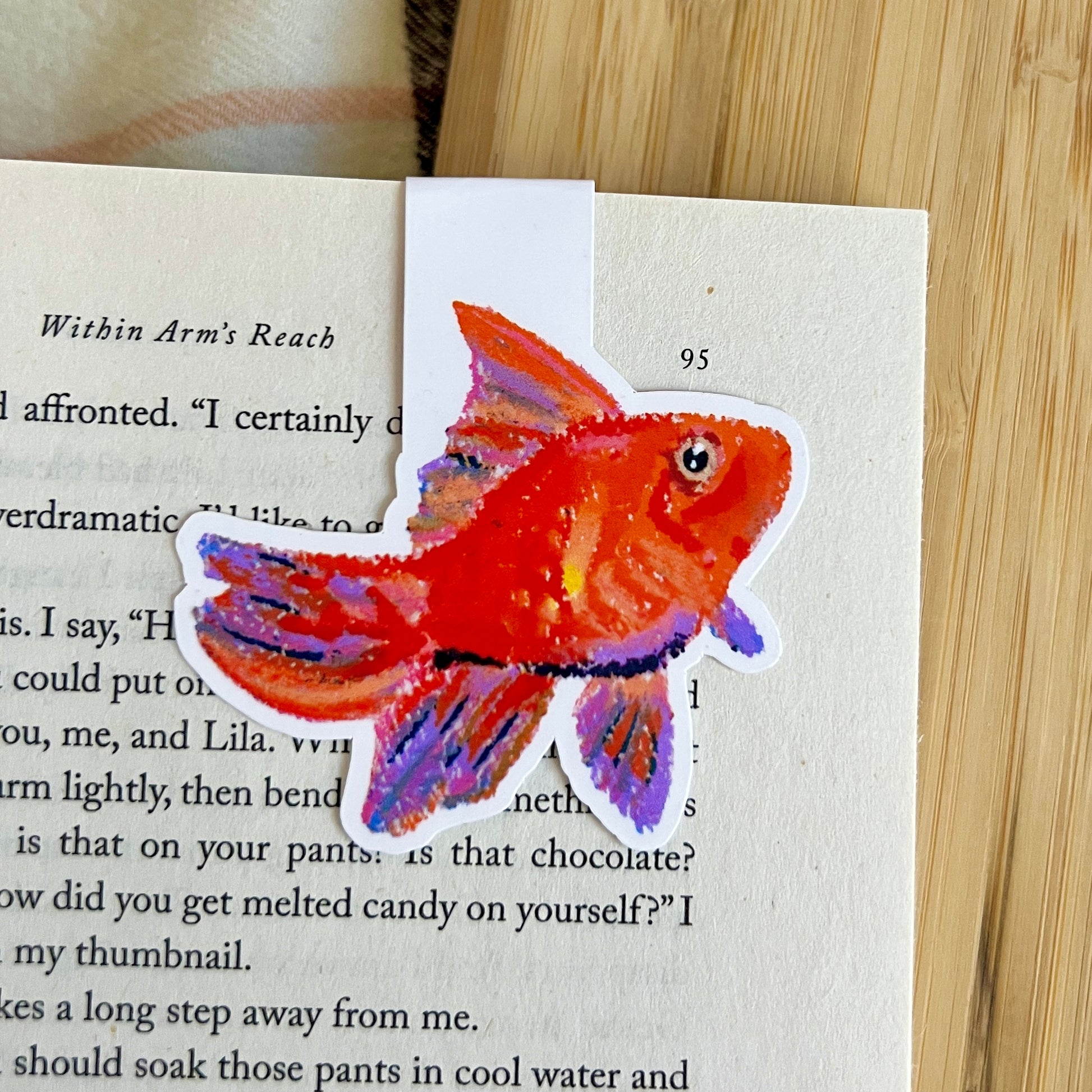 Colorful fish sticker on a book page