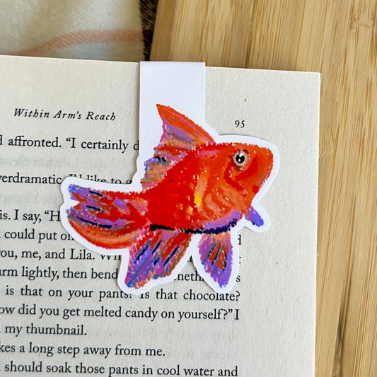 Colorful fish sticker on a book page