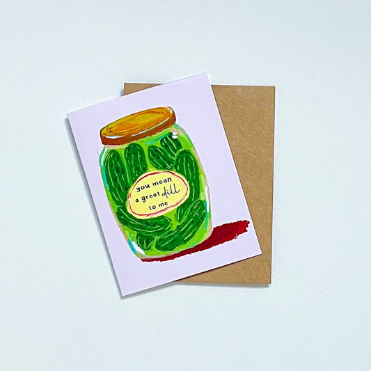 Greeting card with a pickle jar illustration and text 'You Mean A Great Dill To Me' on a white background