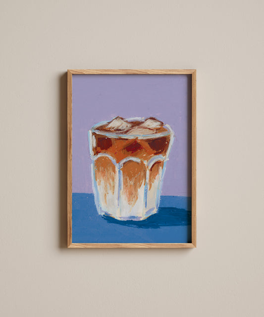 Framed artwork of a glass with a drink on a purple and blue background