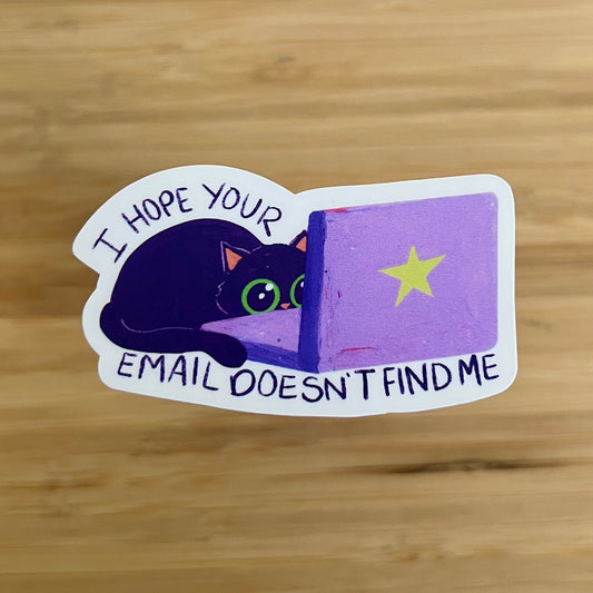 sticker of cat behind laptop and text 'I hope your email doesn't find me'