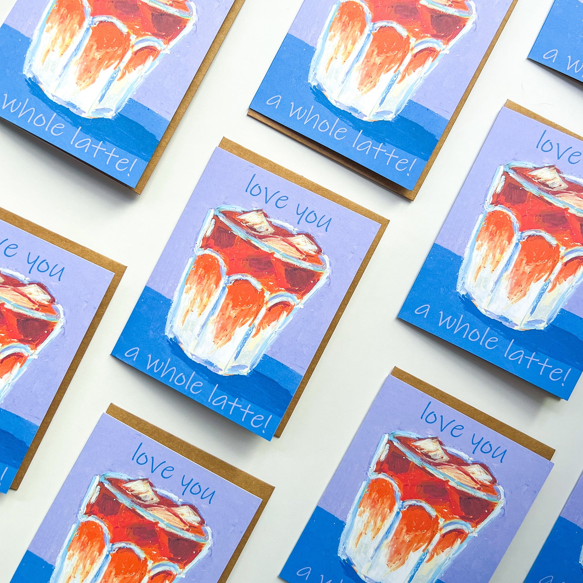 Greeting cards with a coffee cup illustration and text 'love you a whole latte' on a white background