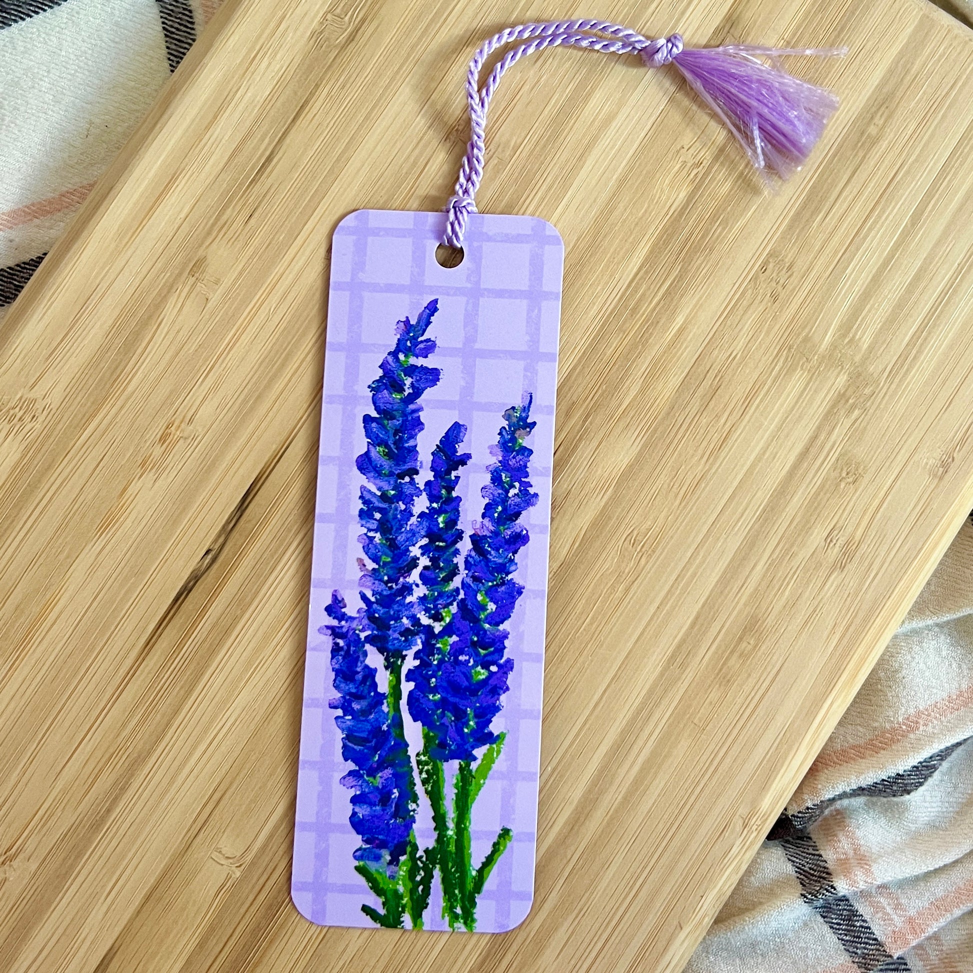 Bookmark with lavender design on a wooden surface