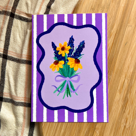 illustrated lavender and sunflowers tied with a bow on a purple striped background