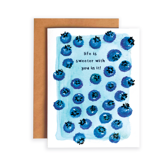 Greeting card with blueberry pattern and text 'life is sweeter with you in it' on a white background.