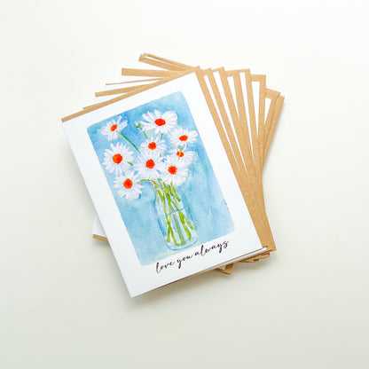 greeting cards with a vase of daisies illustration and text 'love you always'