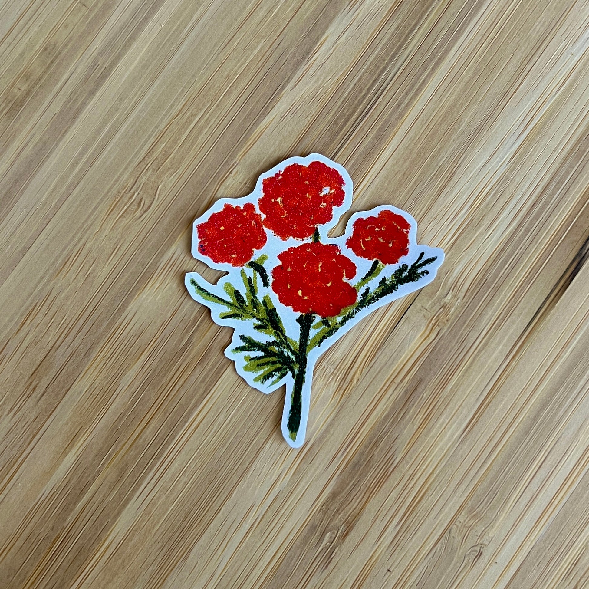 Sticker of red flowers on a wooden surface