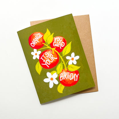 Greeting card with orange design and 'orange you glad It's Your Birthday' text on a white background