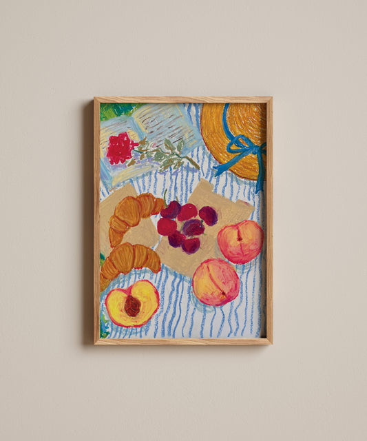 Framed artwork of fruits and flowers on a textured surface