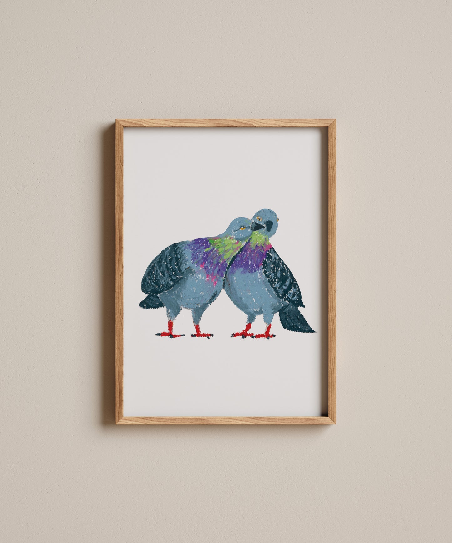 Framed artwork of two colorful birds on a beige wall