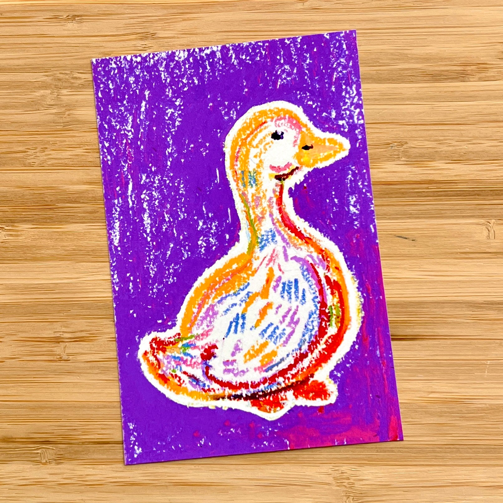 drawing of a goose in oil pastel with a purple background