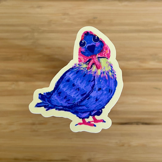 Colorful pigeon sticker on a wooden surface
