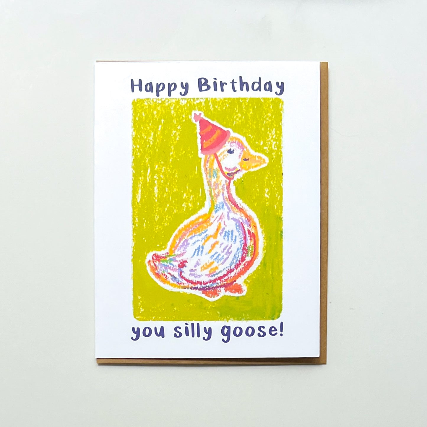 greeting card with illustration of a goose in a party hat and text 'happy birthday you silly goose'