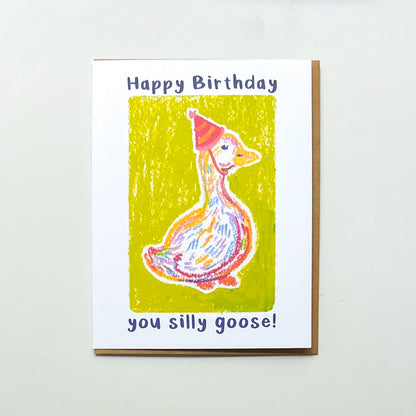 greeting card with illustration of a goose in a party hat and text 'happy birthday you silly goose'