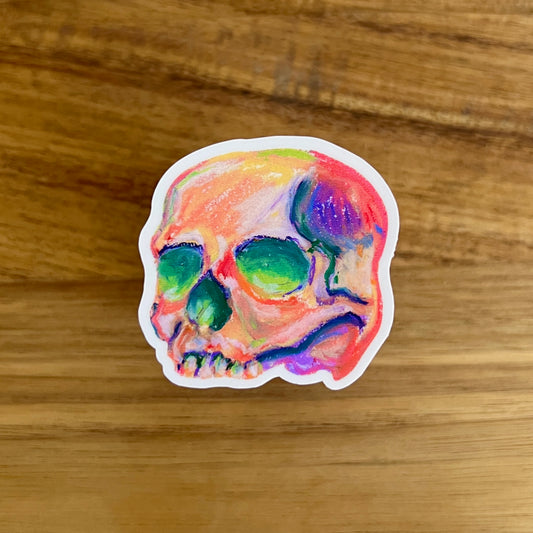 Colorful skull design sticker on a wooden surface