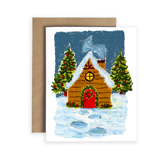 Greeting card with a winter scene featuring a cabin and trees, on a white background.