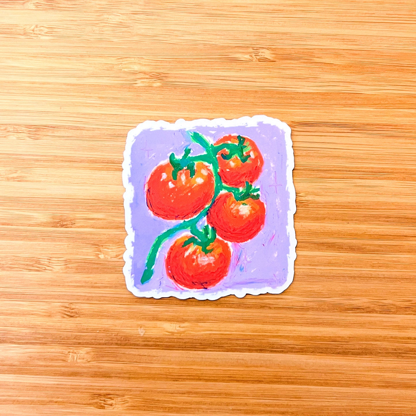 Sticker of tomatoes on a purple background, placed on a wooden surface