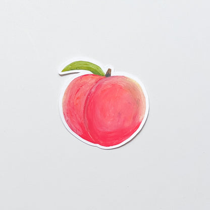 Sticker of a peach on a light gray background