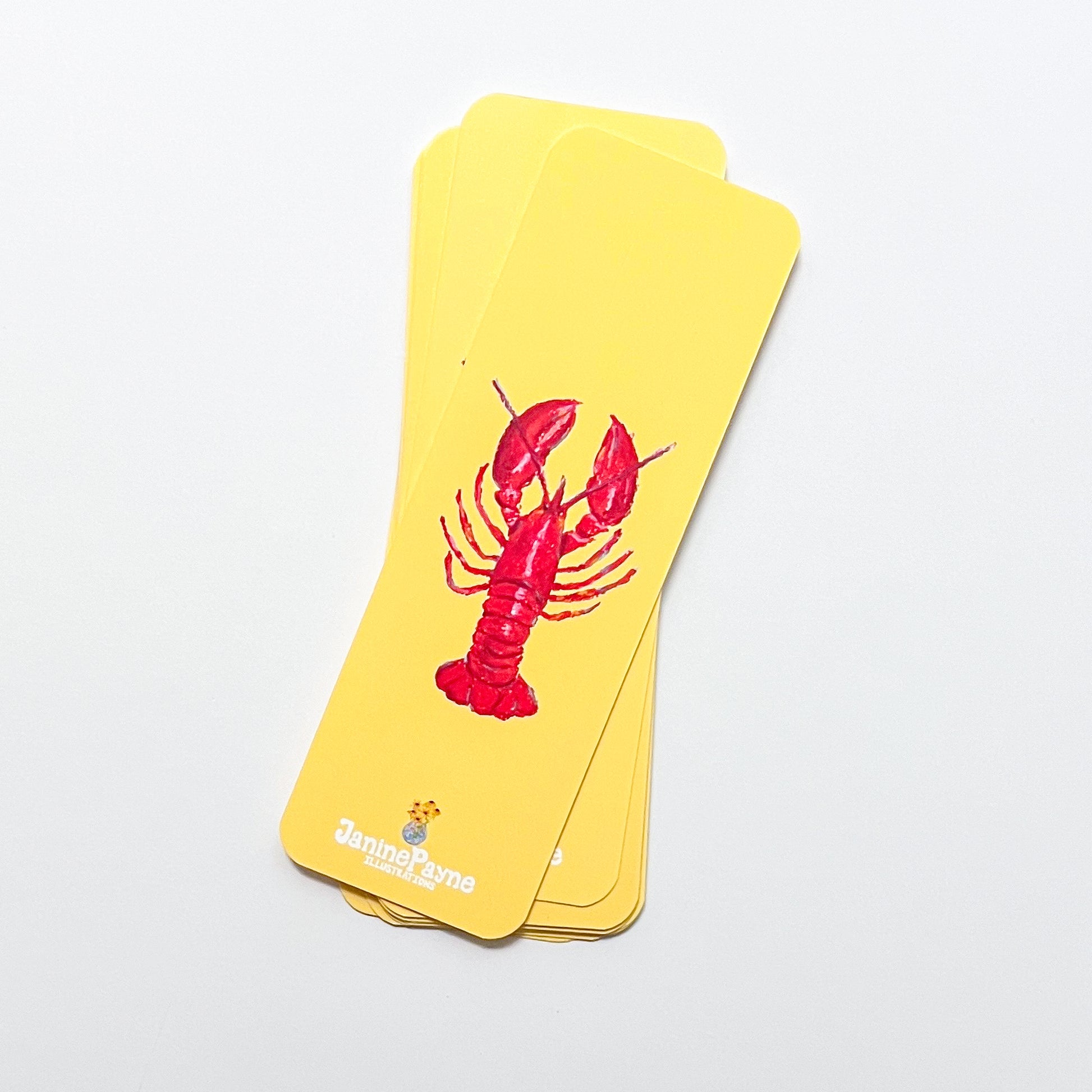 Yellow bookmarks with a red lobster design on a light gray background