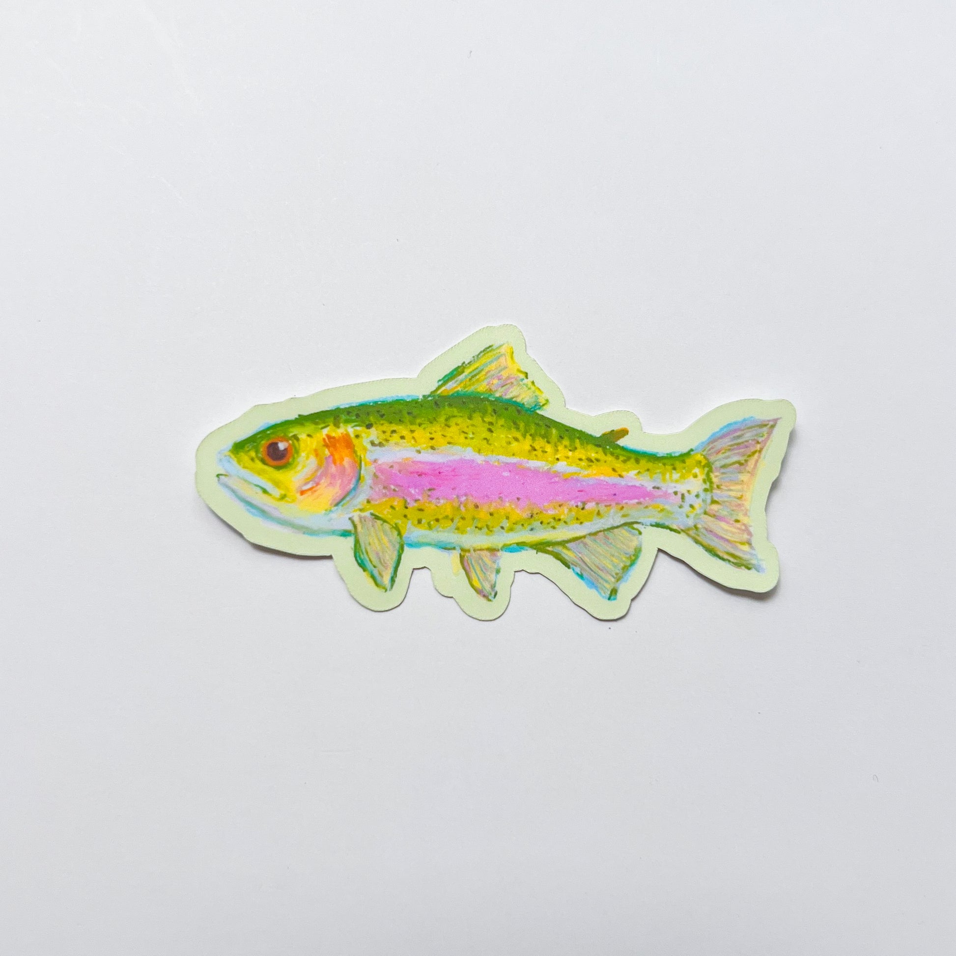 Colorful fish-shaped sticker on a light gray background