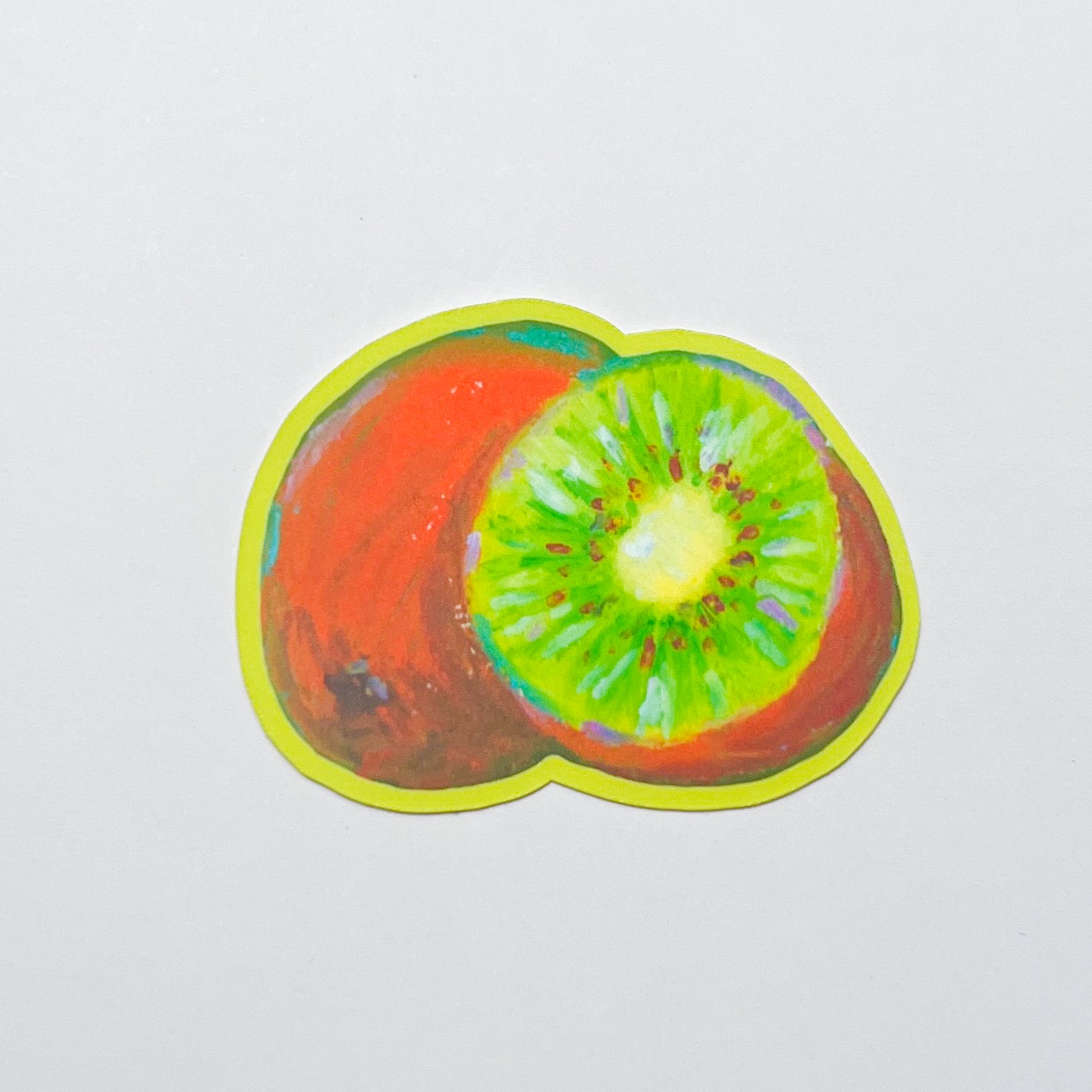 Sticker of a sliced kiwi fruit on a white background