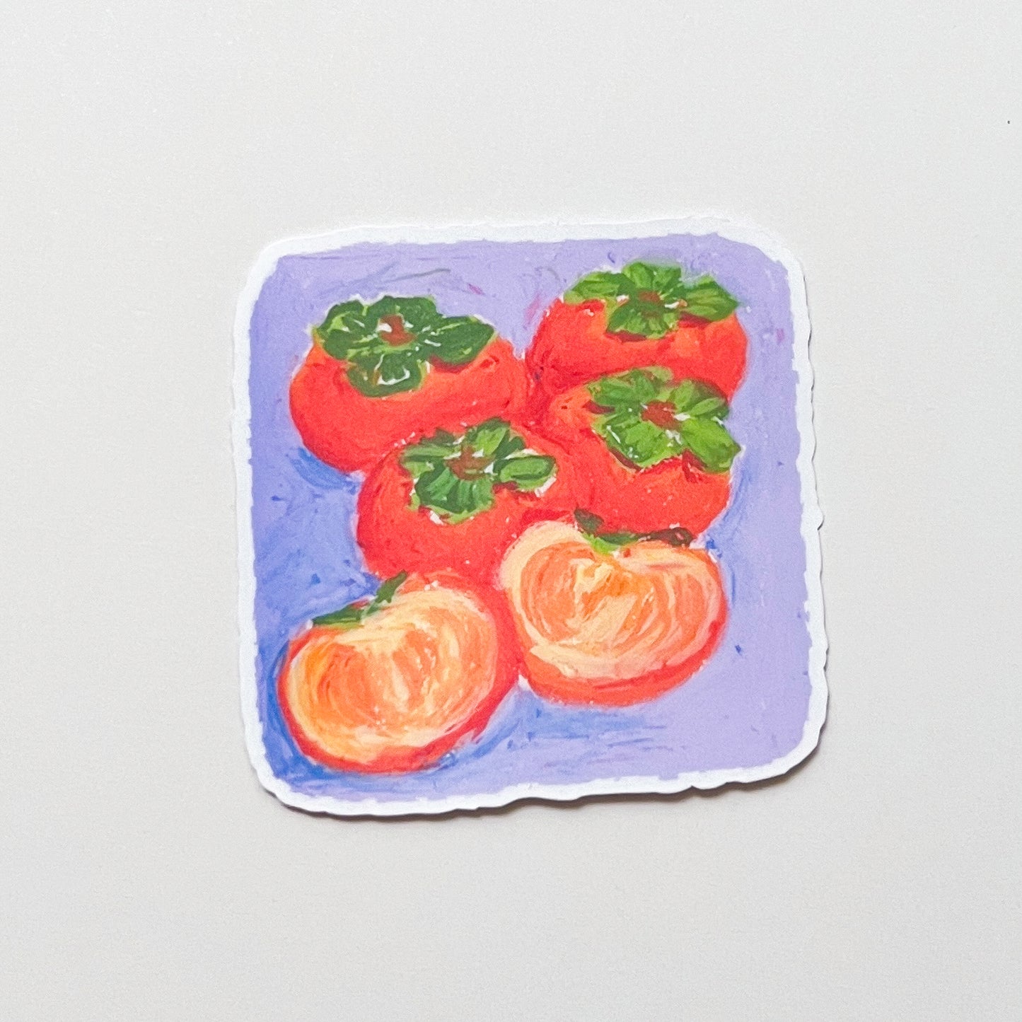 Sticker with a design of persimmons on a purple background