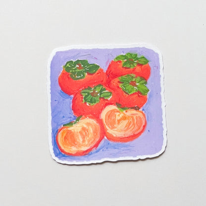 Sticker with a design of persimmons on a purple background