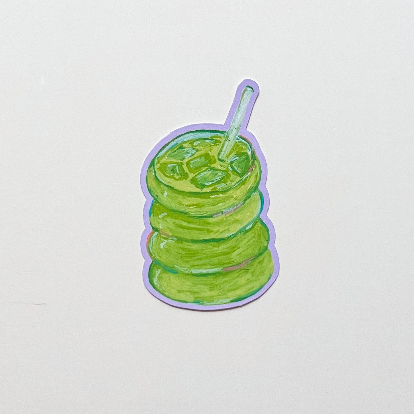 Illustration of a iced matcha with a straw on a light gray background