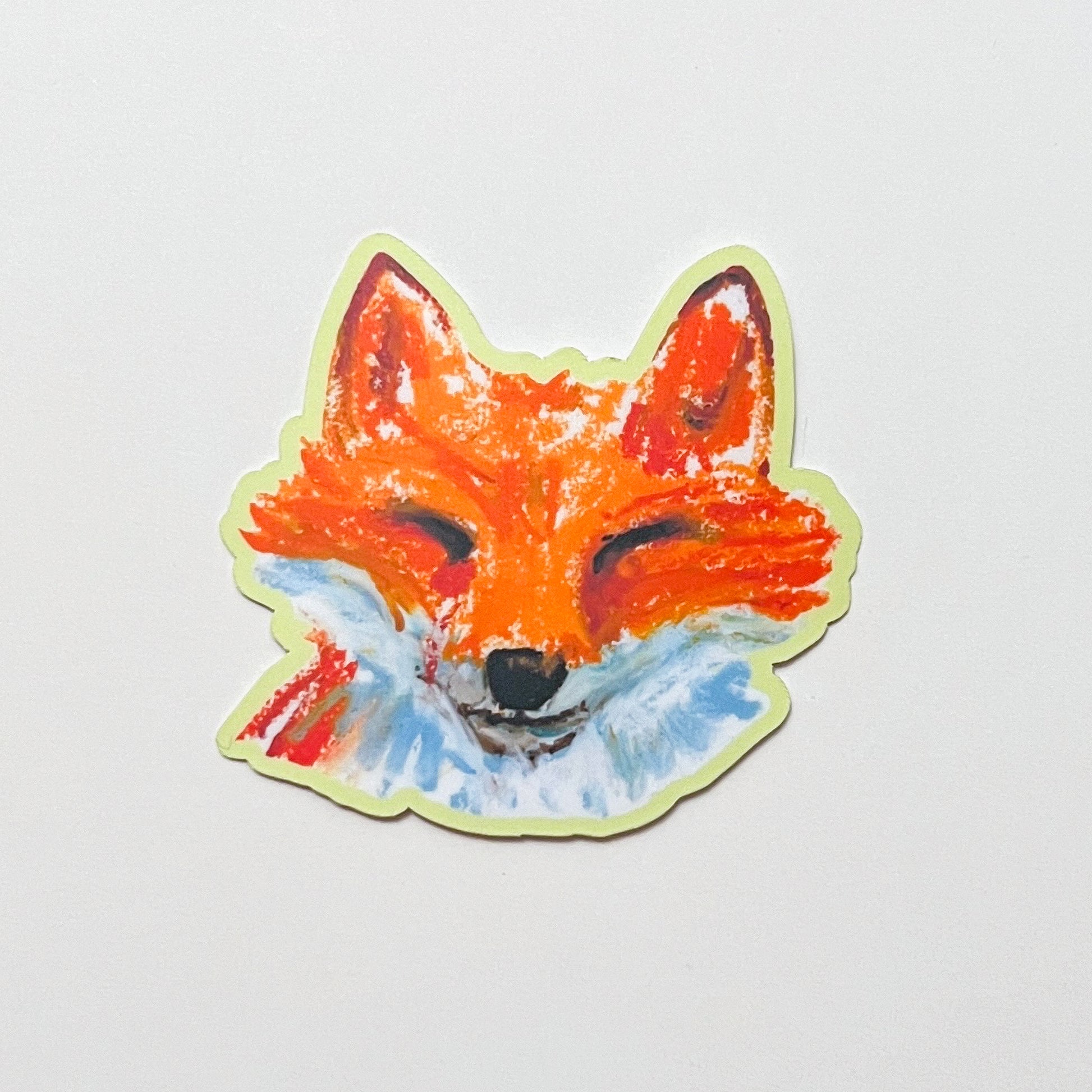 Sticker of a fox face on a light gray background