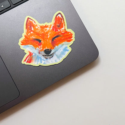 Colorful fox sticker on a laptop