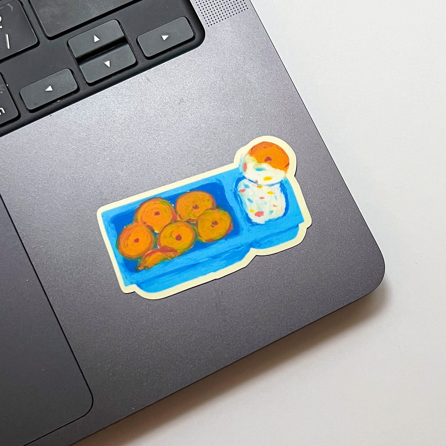 Sticker of dunkaroos on a laptop