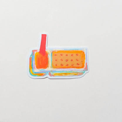 Colorful illustration of a cheese and crackers sticker on a light gray background