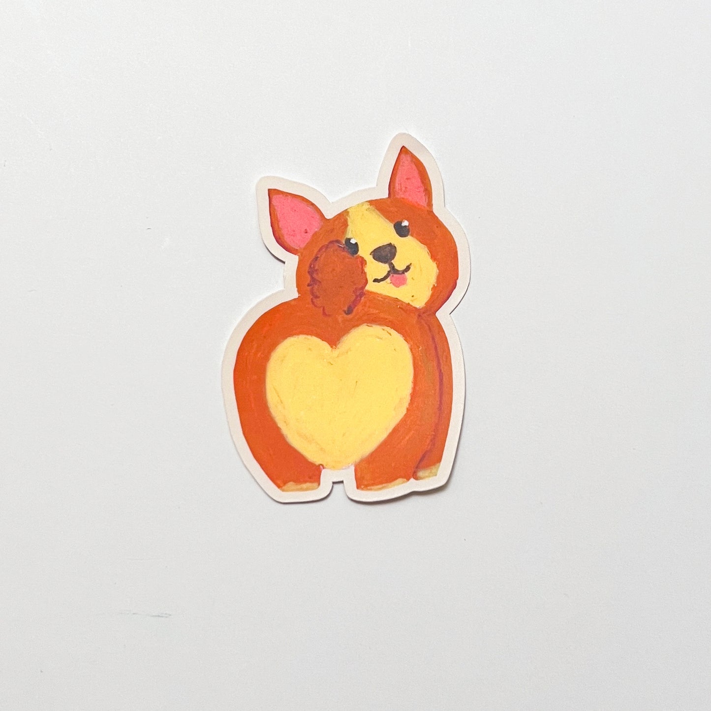 Sticker of a cartoon dog with a heart-shaped body on a light gray background