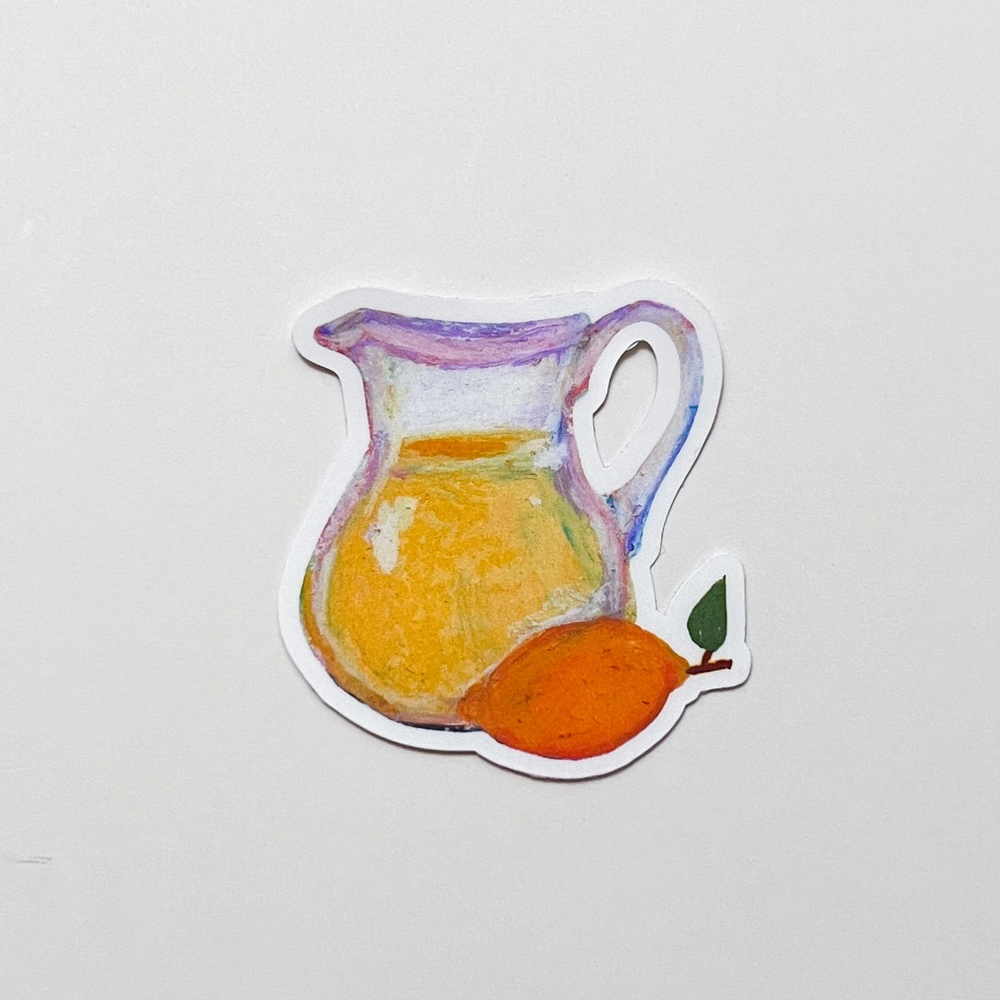 Sticker of a pitcher with lemonade and a lemon on a light gray background