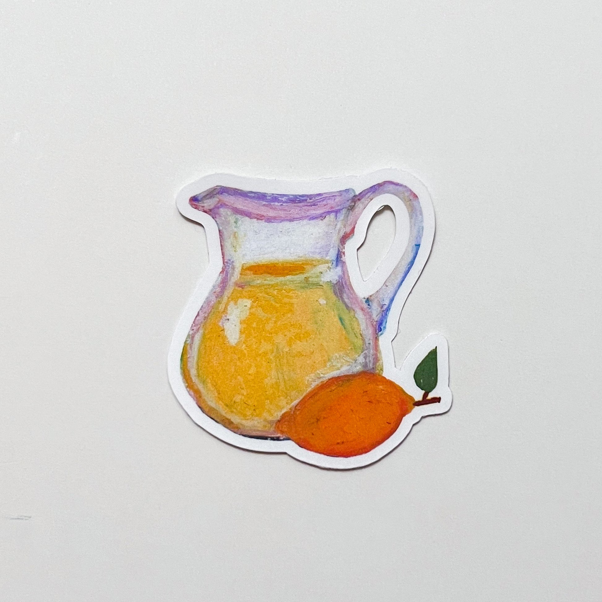 Sticker of a pitcher with lemonade and a lemon on a light gray background