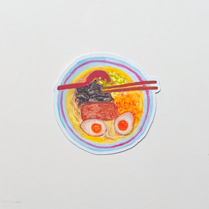 Sticker of a bowl of ramen with chopsticks on a white background