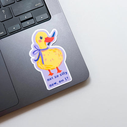 Sticker of a duck with a bow on a laptop
