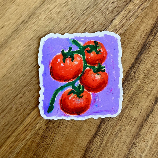 Sticker of tomatoes on a vine with a purple background on a wooden surface