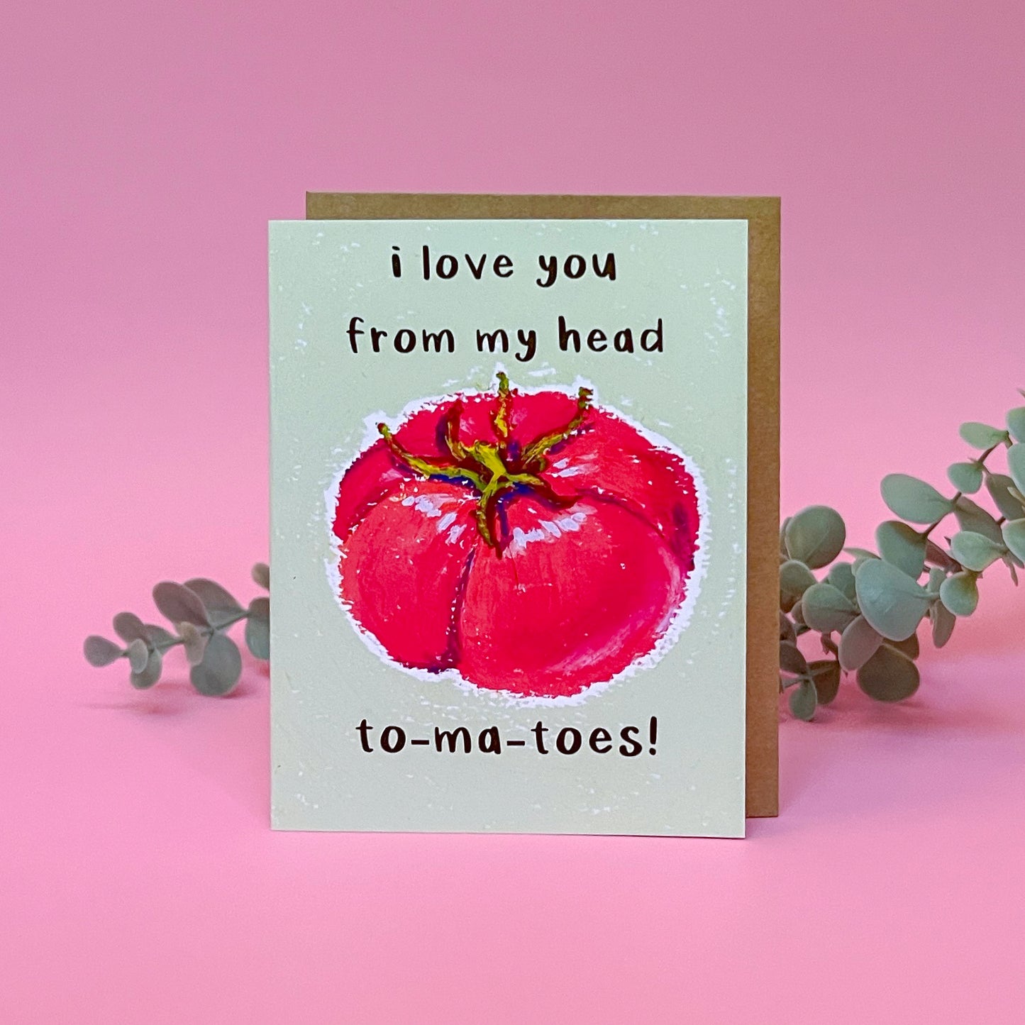Card with a tomato illustration and text 'I love you from my head tomatoes' on a pink background