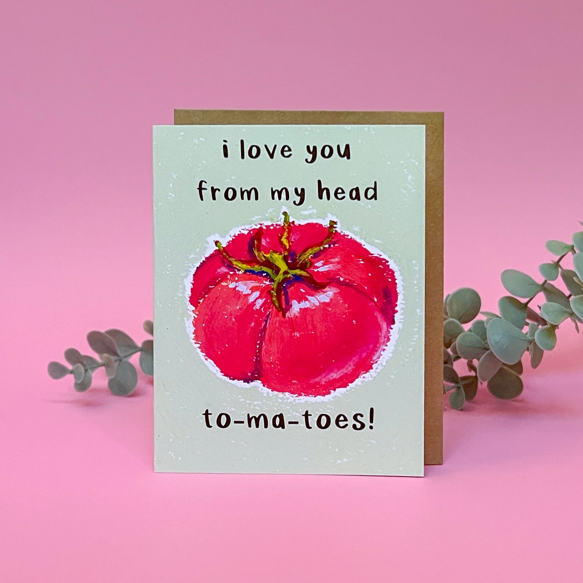 Card with a tomato illustration and text 'I love you from my head tomatoes' on a pink background