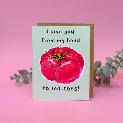 Card with a tomato illustration and text 'I love you from my head tomatoes' on a pink background