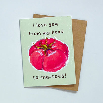 greeting card with Kraft envelope with text 'I love You From My Head Tomatoes' on white background