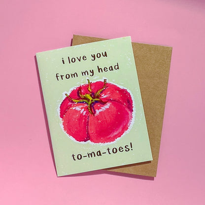Card with tomato illustration and text 'I love you from my head tomatoes' on a pink background