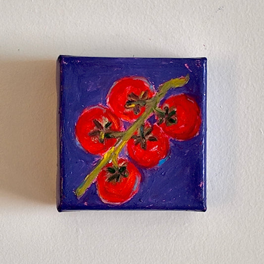 Small painting of red tomatoes on a purple background