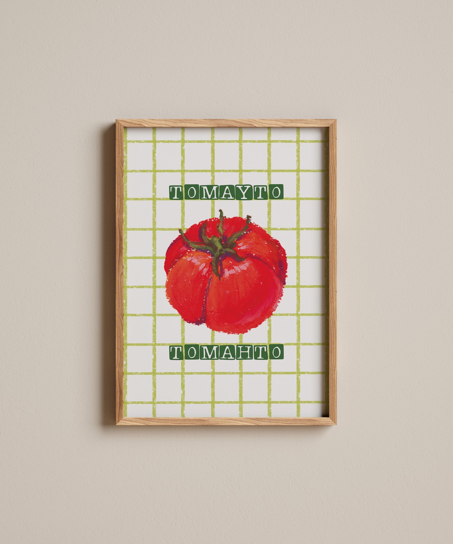 Framed artwork of a red tomato with 'Tomato' text on a grid background.
