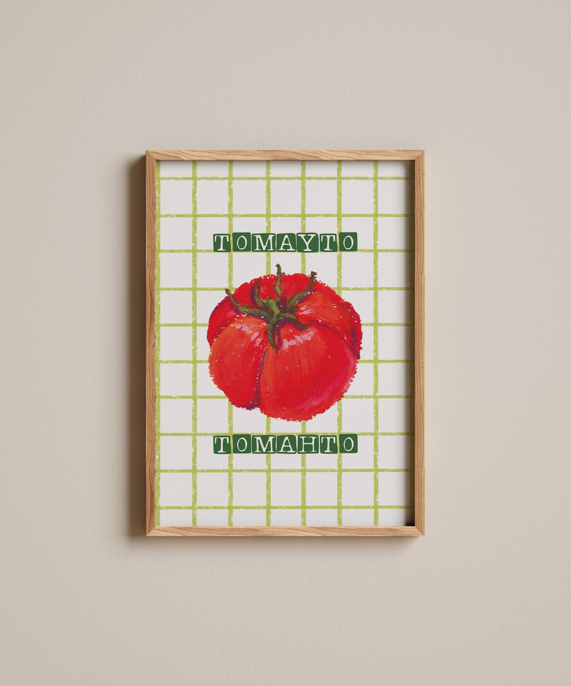 Framed artwork of a red tomato with 'Tomato' text on a grid background.